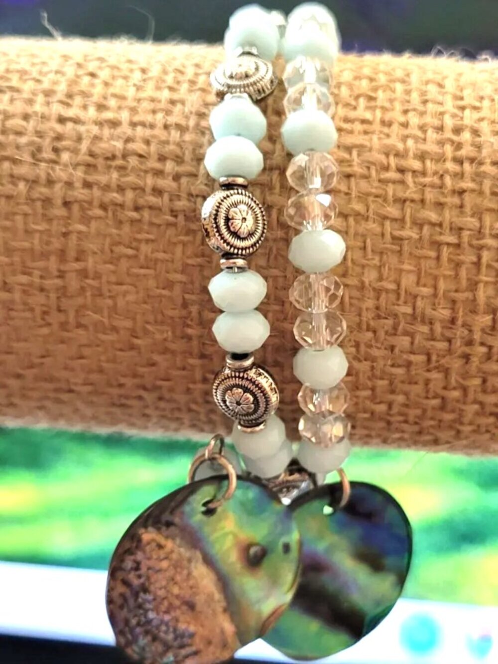 Eye Popping Pale Green Beads Adorned with Silver Dividers and Charms